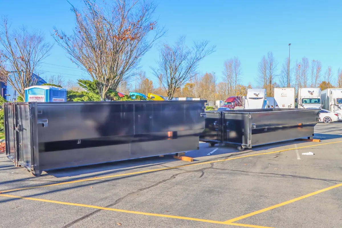 Professional dumpster rental service with roll-off container on residential driveway in Selah